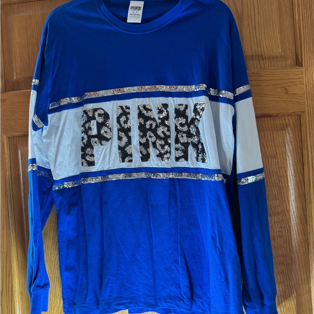 Sparkle with this Blue and white long sleeve made by Victoria’s Secret shirt